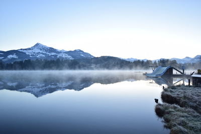 Scenic view of the schwarzsee against clear sky during winter