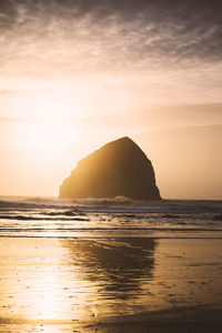 Scenic view of sea against sky at sunset