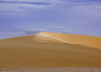 Scenic view of desert against sky