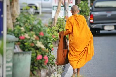Rear view of woman standing in city