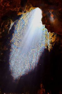 Low angle view of rock formation in water