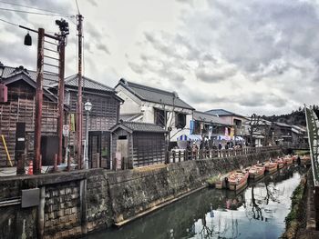 View of buildings against cloudy sky