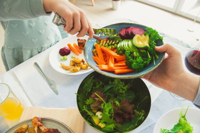 High angle view of woman preparing food on table