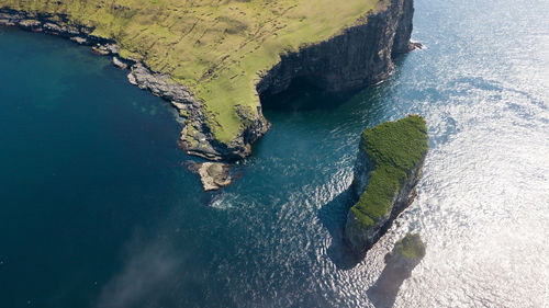 High angle view of rock formation in sea