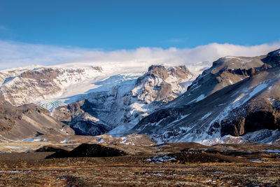 Scenic view of snowcapped mountains against sky