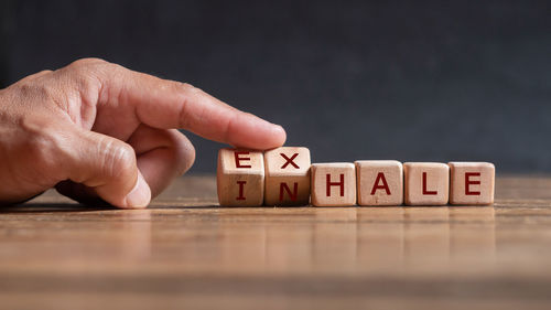 Person hand with text on table