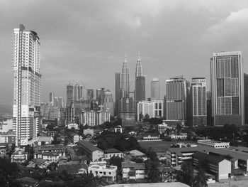 High angle view of buildings in city against sky
