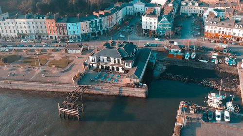 High angle view of river amidst buildings in city