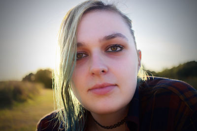 Close-up portrait of smiling young woman