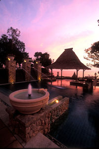 View of swimming pool against sky at sunset