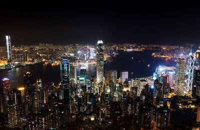 High angle view of city lit up at night