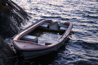 High angle view of abandoned boat moored on sea