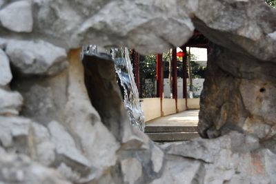 Close-up of rock by building