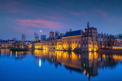 Reflection of illuminated buildings in water