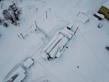 High angle view of ski lift on snow covered field