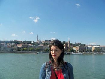 Portrait of young woman in river