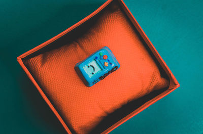 High angle view of information sign on table against blue background