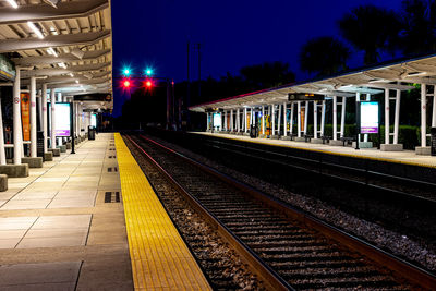 Railroad station platform at night