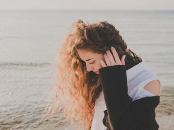 Woman standing on beach