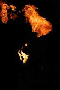 Close-up of fire against black background