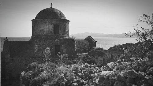 Old building against sea and sky