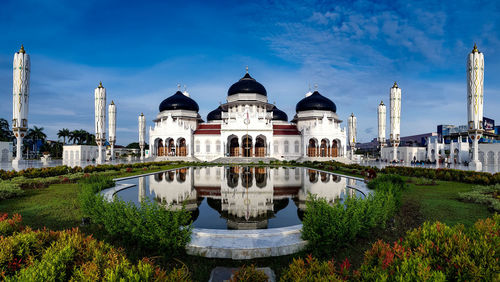 Panoramic view of buildings in city against sky