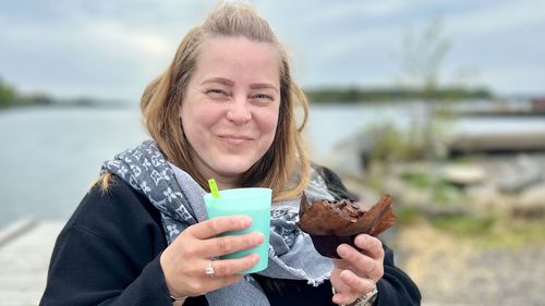 Portrait of young woman drinking coffee