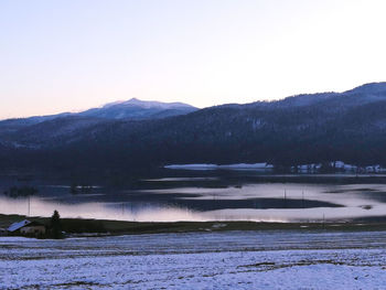 Scenic view of frozen lake against clear sky