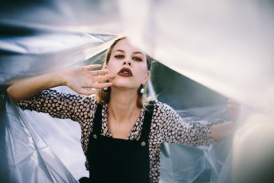 Portrait of young woman in plastic