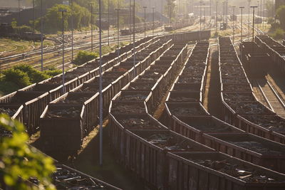 High angle view of railroad tracks by road in city