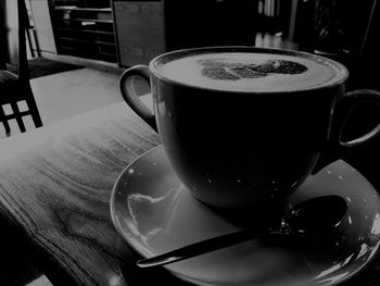 Close-up of coffee cup on table