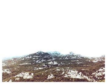 Scenic view of snowcapped mountains against clear sky