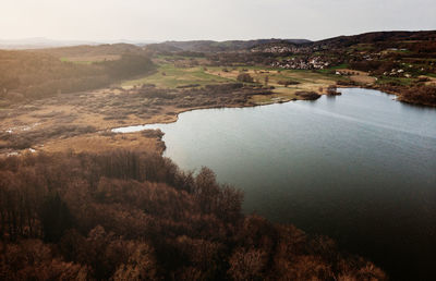 High angle view of river amidst trees against sky