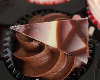 Close-up of chocolate cupcake in baking sheet