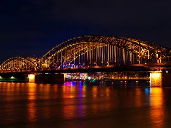 Illuminated bridge at night