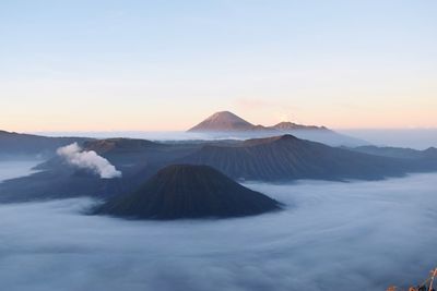 Scenic view of volcanic landscape against sky during sunset