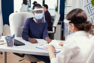 Doctor examining patient at clinic