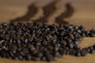 Close-up of coffee beans on table