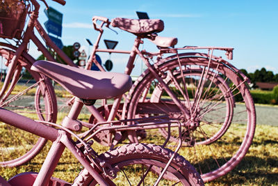 Close-up of bicycle wheel on field