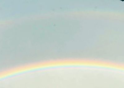Scenic view of rainbow against sky during sunset