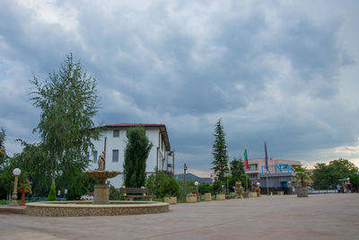 Exterior of building by street against sky