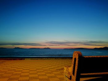 Scenic view of calm sea at sunset