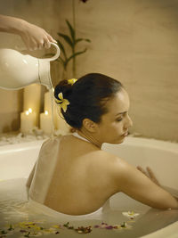 Close-up of young woman in bathroom