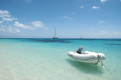 Sailboat on sea against sky