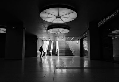 Man walking in illuminated building