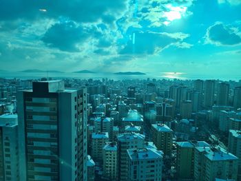 High angle view of buildings in city against sky