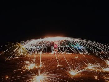 Light trails against sky at night