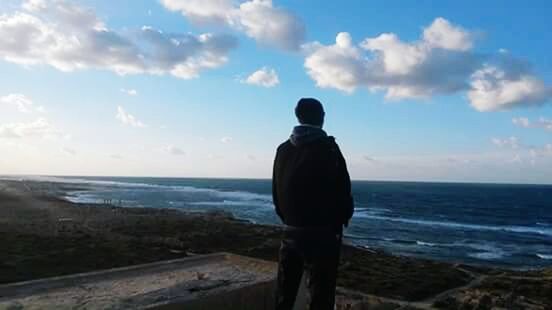 sea, horizon over water, sky, rear view, water, standing, tranquility, scenics, tranquil scene, beauty in nature, nature, lifestyles, cloud - sky, cloud, leisure activity, idyllic, looking at view, men