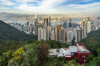 High angle view of buildings in city against sky