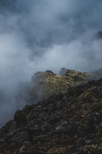 Scenic view of volcanic mountain against sky